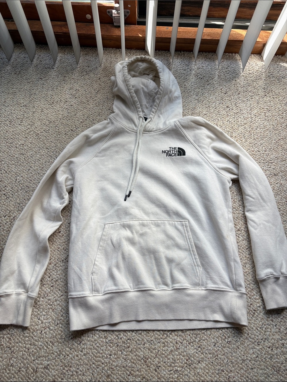 The North Face Cream Hooded Sweatshirt with Black Logo